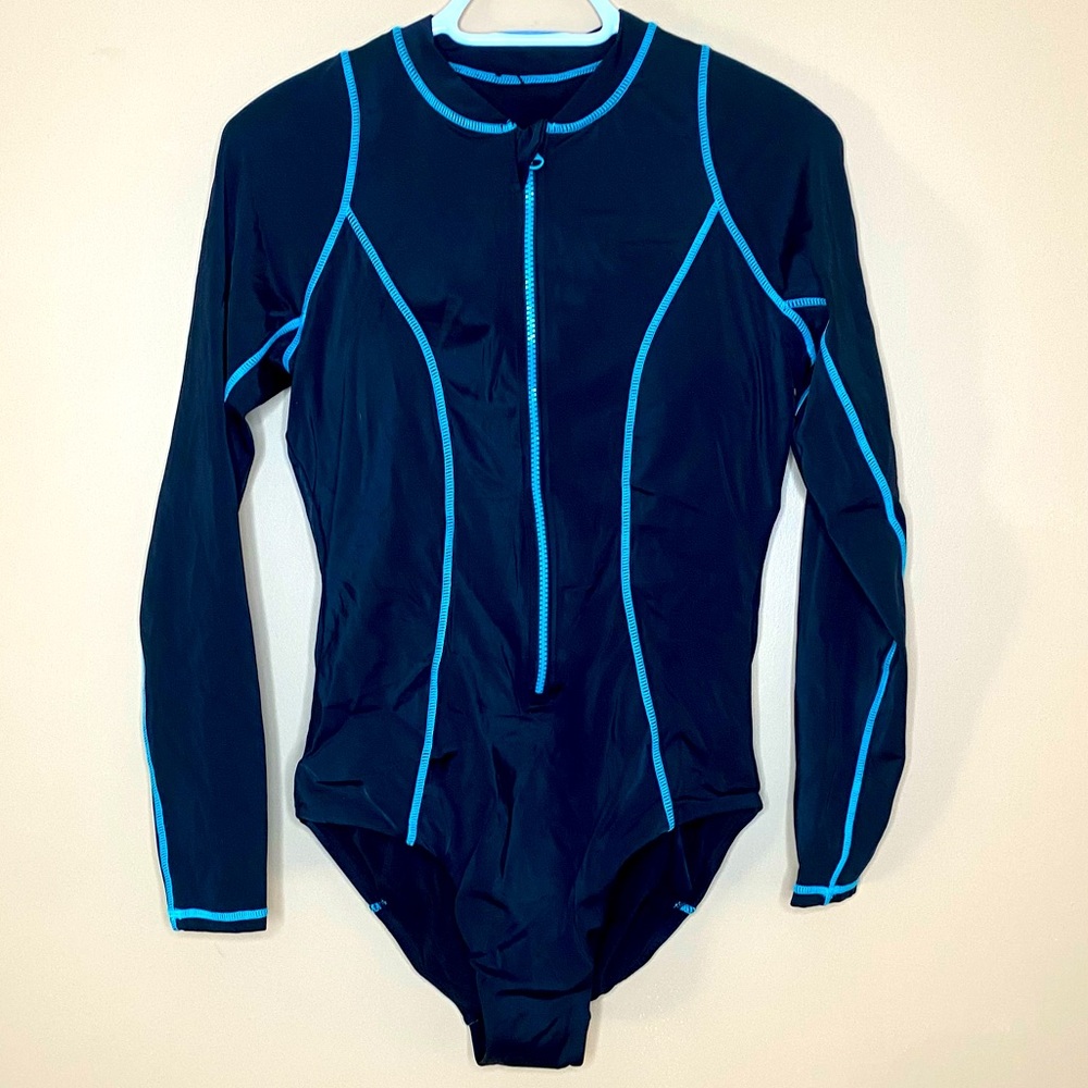 Woman’s long sleeve one piece swim suit.